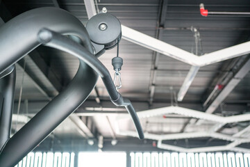 Gym equipment, lat pull down,inside a gym, close up view.