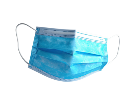 Close-up of a blue disposable face covering against a black background