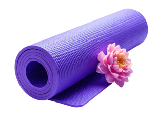 Rolled purple yoga mat and a pink flower on black. Detailed, soft focus