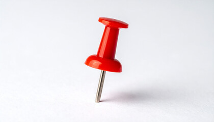 Red push pin isolated on white background, office supplies and stationery product.