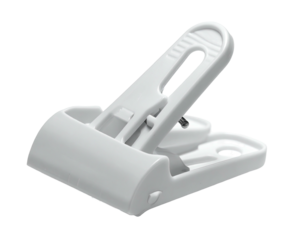 A white plastic clip with a spring-loaded lever, isolated on black