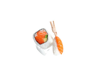 Close-up of sushi pieces, one with salmon, next to wooden chopsticks