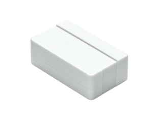 Isometric view of a small, white rectangular device with a lengthwise groove