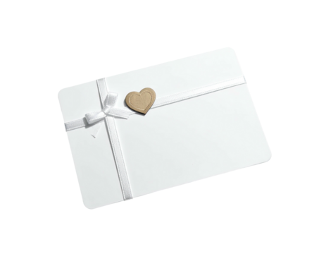 A white card is wrapped with a ribbon, a heart decoration on top, black background