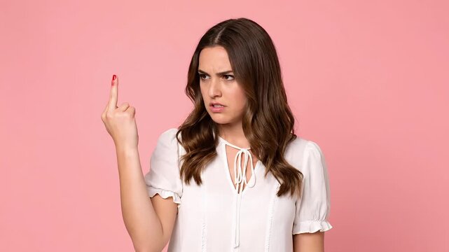 Woman Giving Finger Gesture Disapproval Frustration Anger Portrait Studio Pink Background