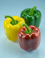 Three colorful bell peppers