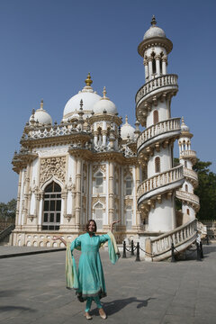 Bahauddin Maqbara, dedicated to Mahabat Khan II - Mahabat Maqbara mausoleum complex in Junagadh, Gujarat, India. Indian architecture, landmark. Beautiful building. Tourist woman in shalwar kameez