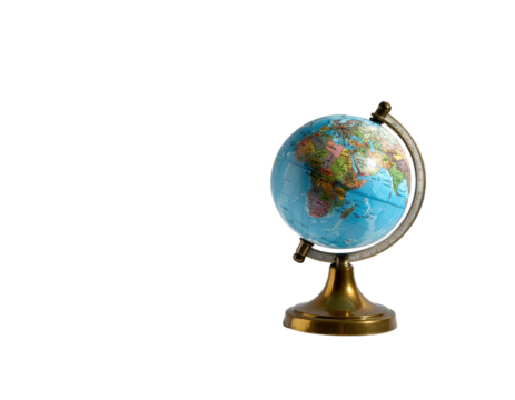 Miniature globe stands on a brass base against a solid black background