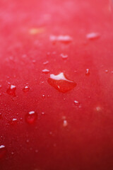 Macro shot of water droplet on cold apple fruit