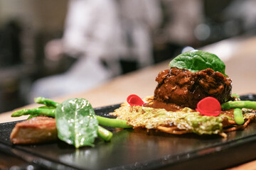 Fine dining beef steak with vegetables and edible garnish
