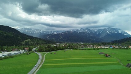 Traditional houses in alpine valley with mountains