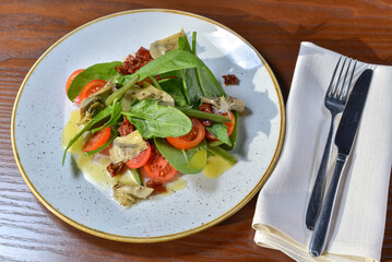 
fresh salad with tomatoes and spinach