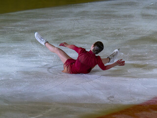 Fall of a Skater Performing an Artistic Performance on the Ice Rink