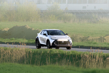 Fototapeta premium SUV driving on open road