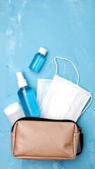 Travel hygiene kit on light blue background