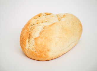 Freshly baked bread roll on a white background