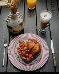 Croissant with filling on a beautiful plate isolated