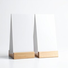 Two blank white signs sit on light wood bases