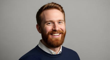 Obraz premium Portrait of a Happy and Confident Young Professional Man Smiling Genuinely Business Headshot Corporate Leader Success Authentic Redhead Man Positive Attitude Leadership Growth