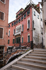 Historic canal bridge with stairs in Venice Italy 