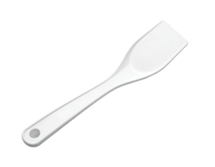 A white, simple cooking spatula with a flat, rectangular blade against black