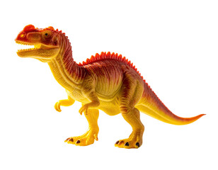 Naklejka premium A small, yellow and red plastic dinosaur toy, isolated on black background