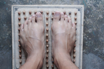 A Relaxing Foot Massage Experience with an Acupressure Wooden Board