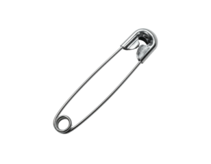A close-up view of a standard safety pin against a stark black background