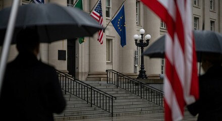 Rainy Day at Government Building with Flags of USA and EU.