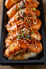 Grilled Salmon Nigiri Sushi with Sesame and Green Onion Topping