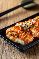 Delicious Grilled Salmon Sushi with Sesame and Green Onion Topping