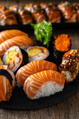 Fresh Salmon Sushi Rolls Served on a Black Slate Plate