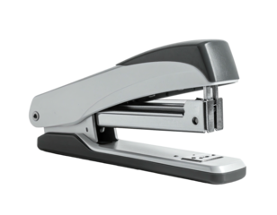 Close-up of a silver and black stapler, isolated on a solid black background