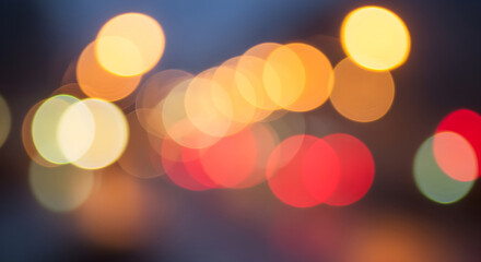 Vibrant city lights bokeh with warm, inviting hues creating a festive, dreamy atmosphere for holiday projects and creative designs