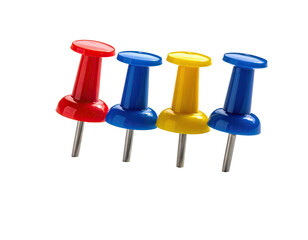 Close-up of four colorful pushpins on a black background