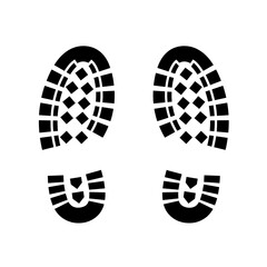 Black shoeprints with tread pattern on white background  