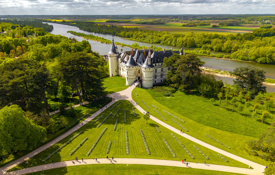 Aerial view of Ch&Atilde;&cent;teau de Chaumont, a medieval fortress with a stunning Loire River backdrop, amidst lush greenery, Chaumont-sur-Loire, Centre-Val de Loire, France.