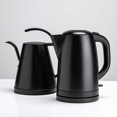 Two black kettles sleek, modern, on white surface