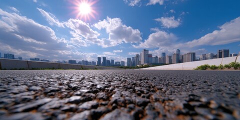 Asphalt Road Leading to Urban Cityscape Skyline