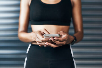 Hands, fitness and woman in city, cellphone and texting with digital app for track progress. Health, outdoor or person with smartphone, social media or internet with exercise, website info or workout