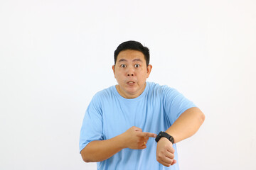 Man Pointing at Watch Looking Concerned About Time
