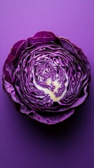 Obraz premium Sliced purple cabbage on a plain background, ideal for articles on healthy eating and cooking blogs.