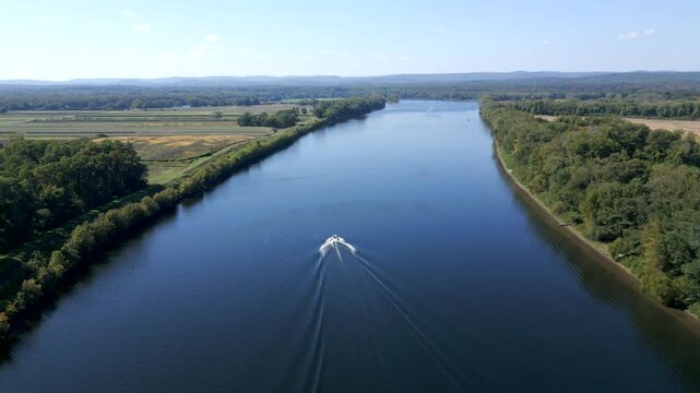 Motorboat Across The Water Of The Connecticut River In Hadley, Massachusetts, United States. Aerial Shot