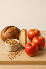 Fresh Apples with Grains and Rustic Sourdough Loaf, Studio Still