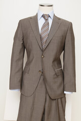 Elegant Brown Suit Displayed on a Mannequin