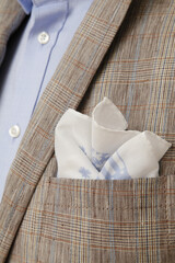 Close-up of a stylish man's suit with a pocket square