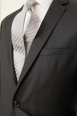 Man in a stylish suit with a striped tie