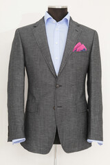 Stylish gray blazer and blue shirt on a mannequin