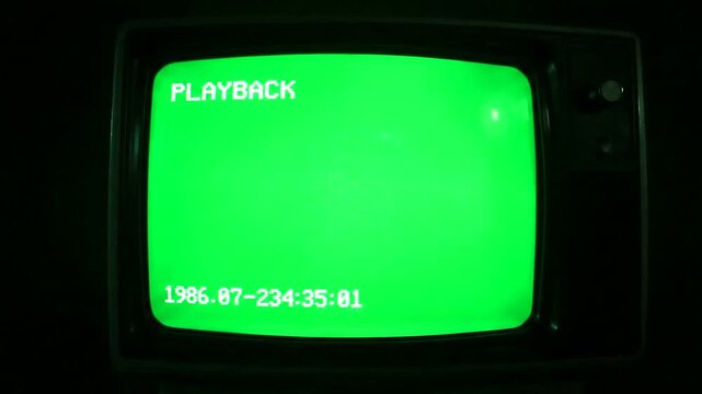 Vintage CRT Monitor with Green Screen and Playback Text from 1986.