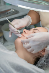 Lip, Facial, Treatment: Clinic Skincare Procedure, Woman receiving professional lip and facial treatment at beauty clinic.